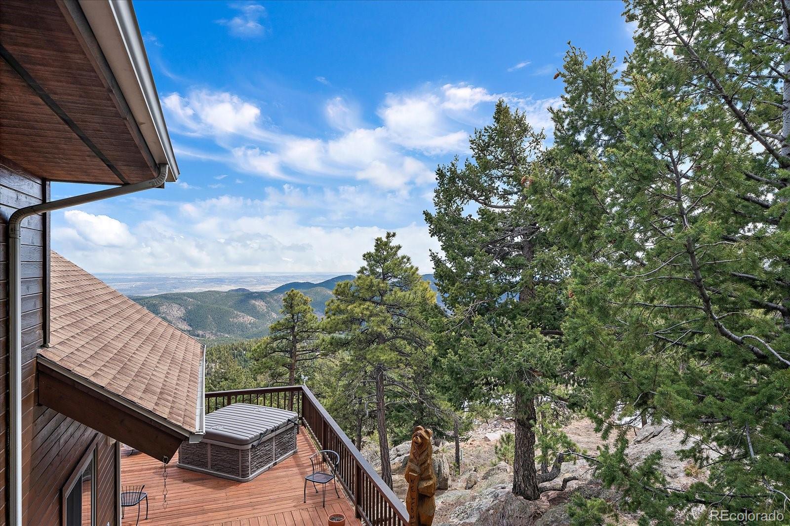 19791 Maxwell Drive Morrison, CO 80465 - Photo 35 of 50 a backyard of a house with lots of green space