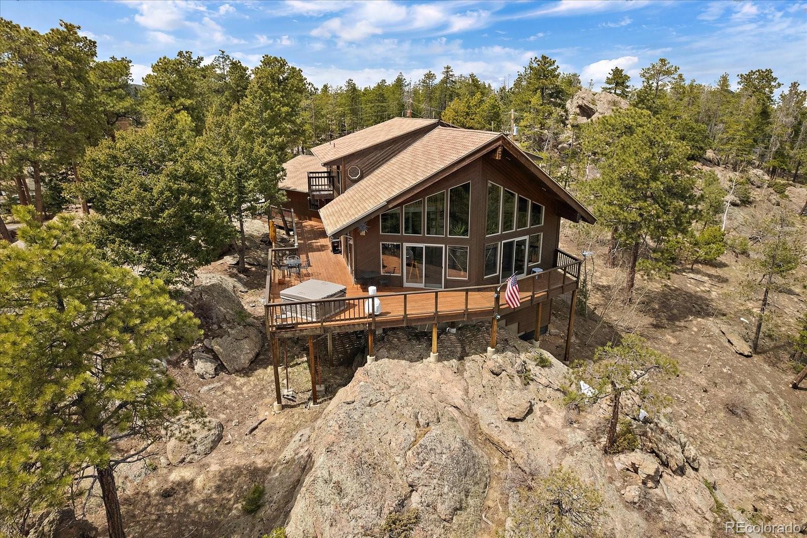 19791 Maxwell Drive Morrison, CO 80465 - Photo 38 of 50 an aerial view of a house with a yard and sitting area