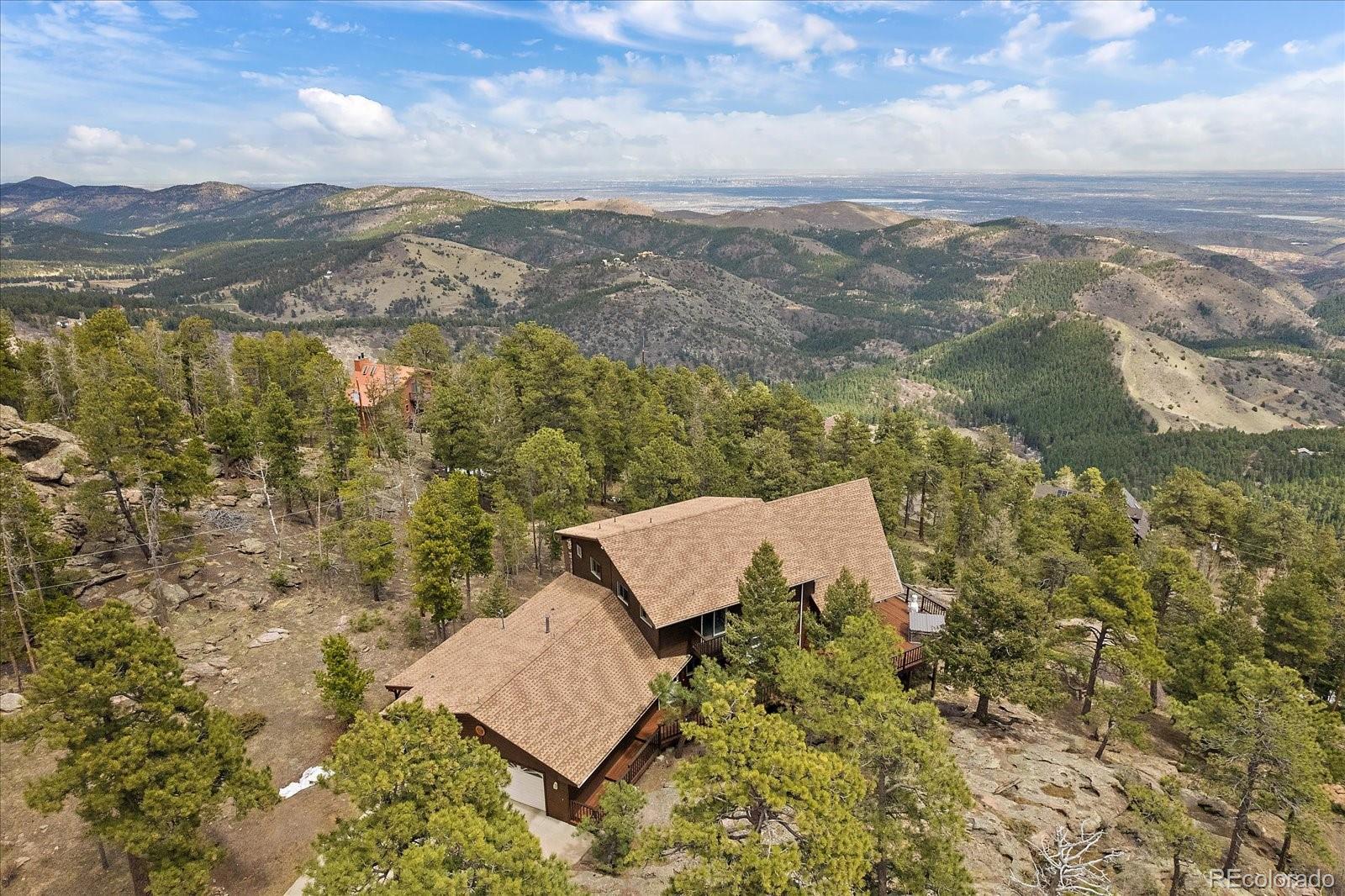 19791 Maxwell Drive Morrison, CO 80465 - Photo 4 of 50 an aerial view of house with yard and mountain view in back