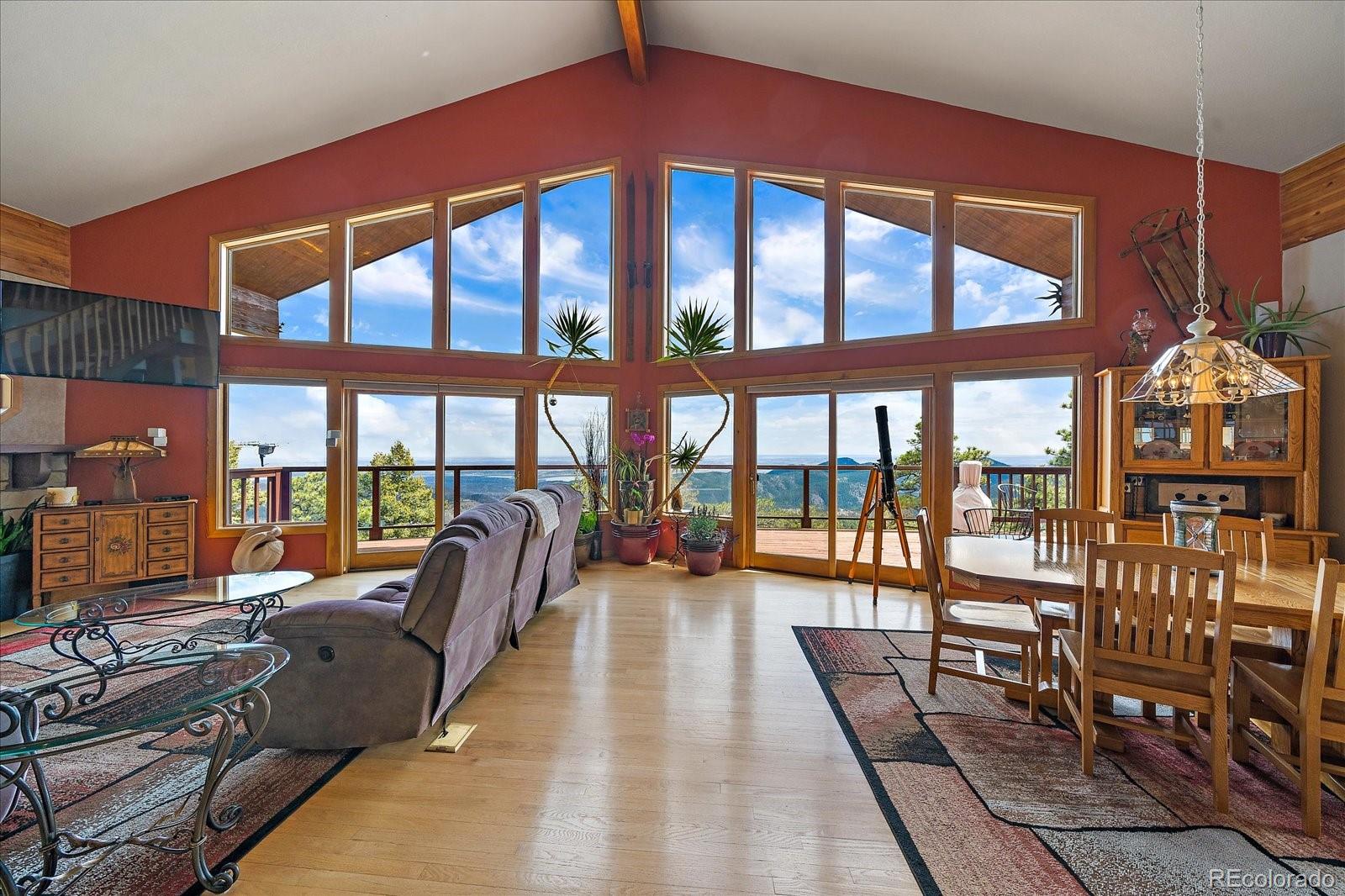 19791 Maxwell Drive Morrison, CO 80465 - Photo 6 of 50 a dining room with furniture and a large window