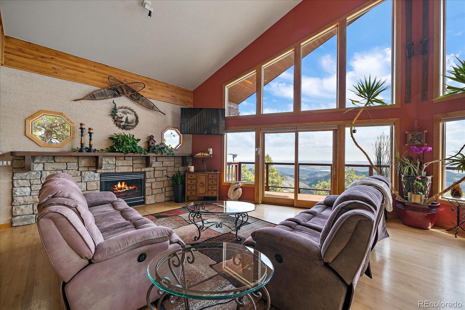 19791 Maxwell Drive Morrison, CO 80465 - Photo 7 of 50 a living room with furniture and a large window