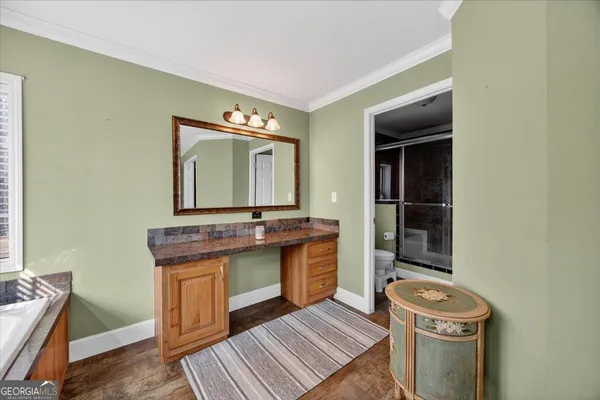 a room with a sink and a mirror