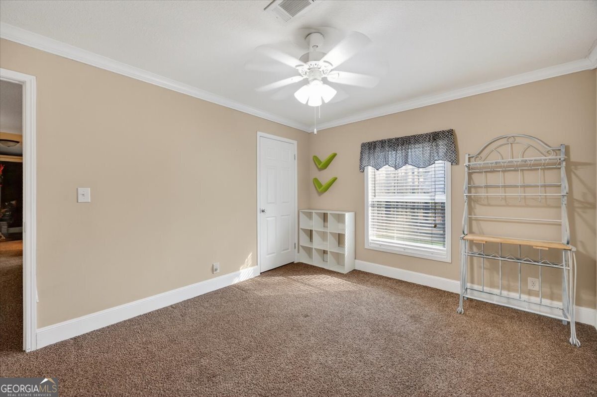 550 Damascus Church Road Haddock, GA 31033 - Photo 17 of 34 a view of an empty room with a window