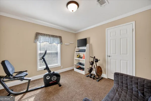 a view of a room with gym equipment