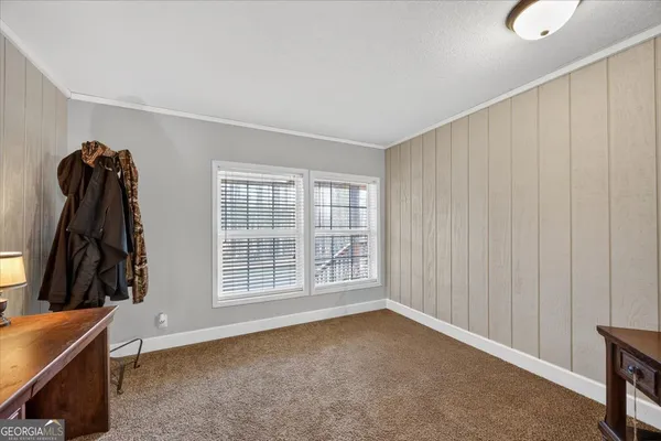 a view of a room with window and a wooden floor
