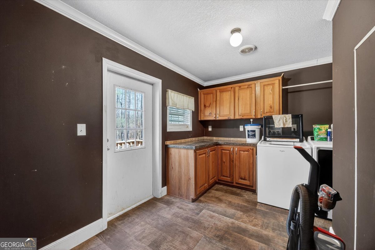 550 Damascus Church Road Haddock, GA 31033 - Photo 26 of 34 a kitchen with a refrigerator and a stove top oven