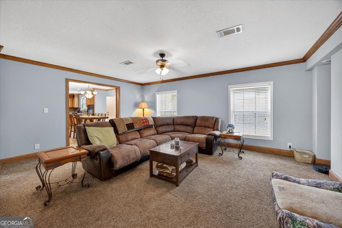 550 Damascus Church Road Haddock, GA 31033 - Photo 5 of 34 a living room with furniture and a window