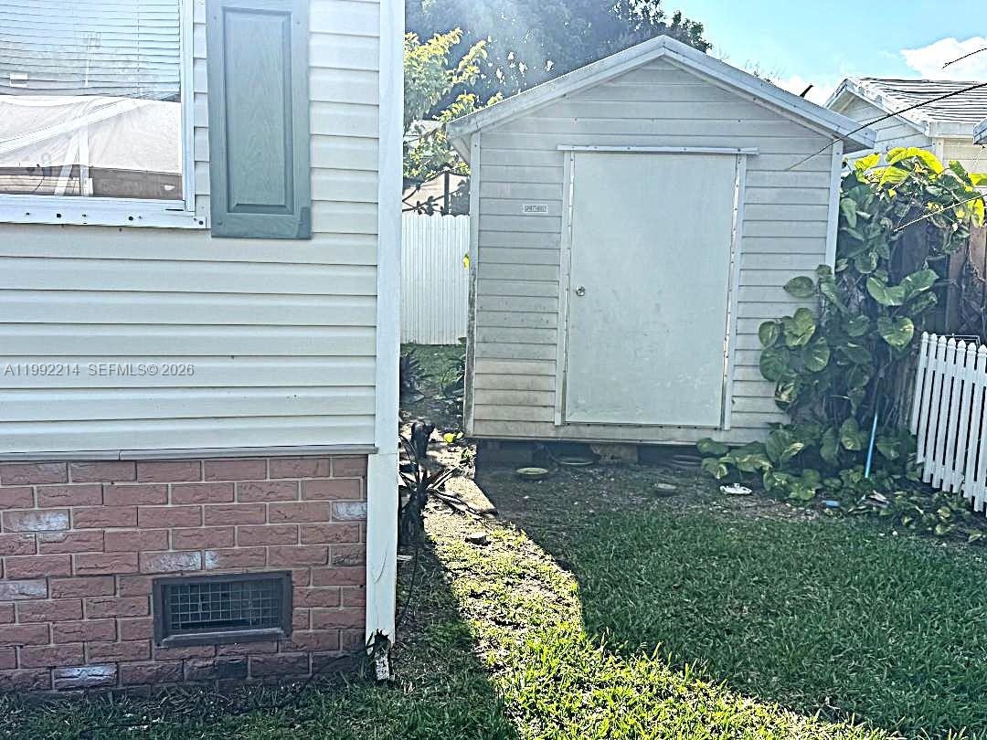 220 Northeast 12th Avenue, Unit 182 Homestead, FL 33030 - Photo 5 of 9 a front view of a house with garden