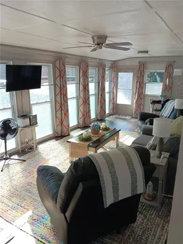 a large bedroom with a bed and wooden floor