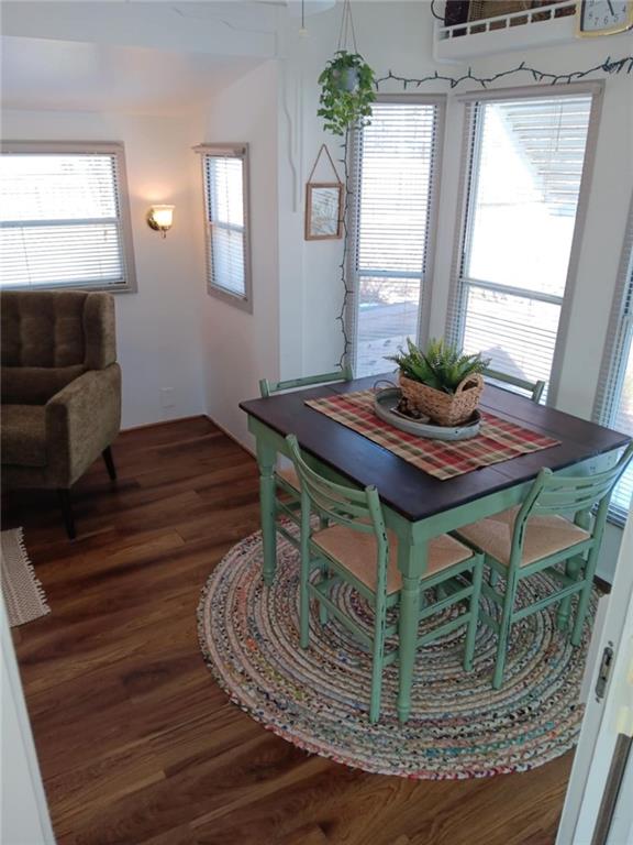 4 Fleetwood Road Cleveland, GA 30528 - Photo 17 of 45 a dining room with wooden floor a glass table and chairs