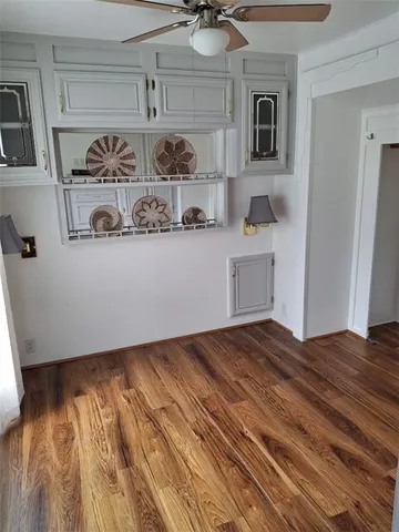 a view of kitchen and wooden floor