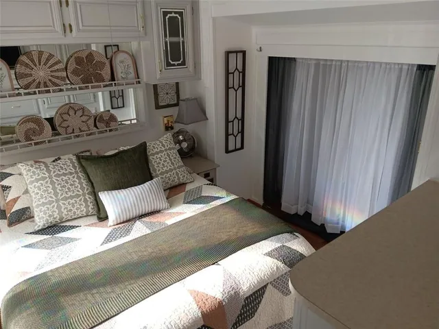 a bedroom with a bed and closet