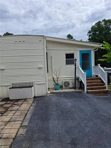 a front view of a house with garage