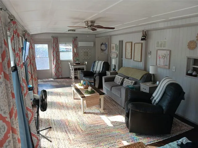 a living room with furniture or couch and a bookshelf