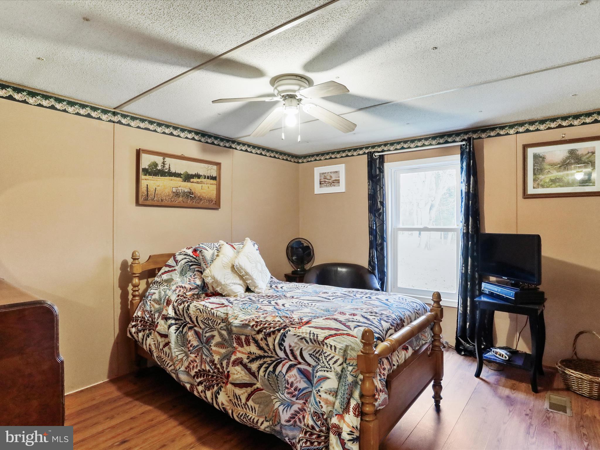 11713 Ernstville Road Big Pool, MD 21711 - Photo 12 of 47 a bedroom with a bed and a flat screen tv
