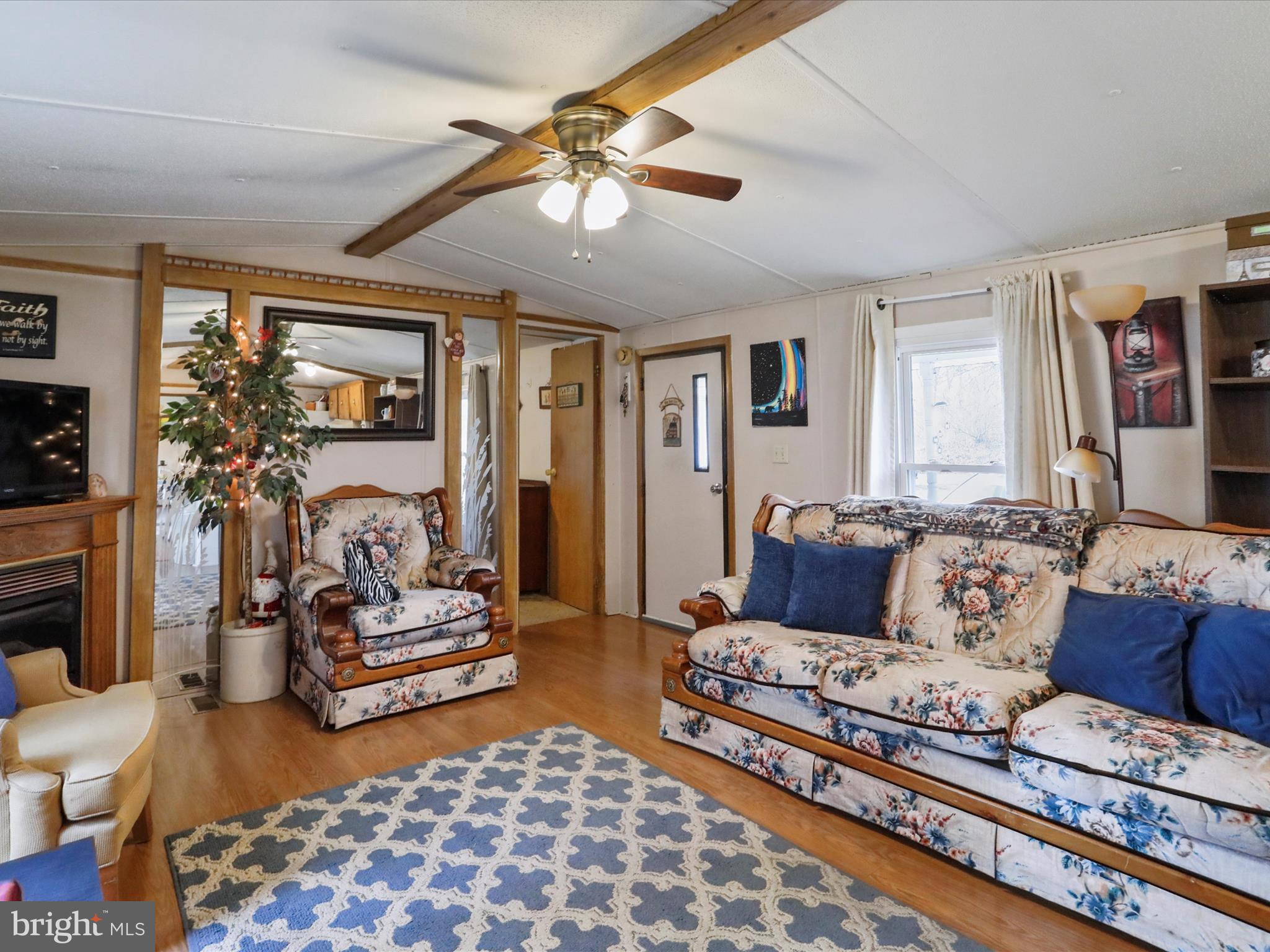 11713 Ernstville Road Big Pool, MD 21711 - Photo 4 of 47 a living room with furniture ceiling fan and a rug