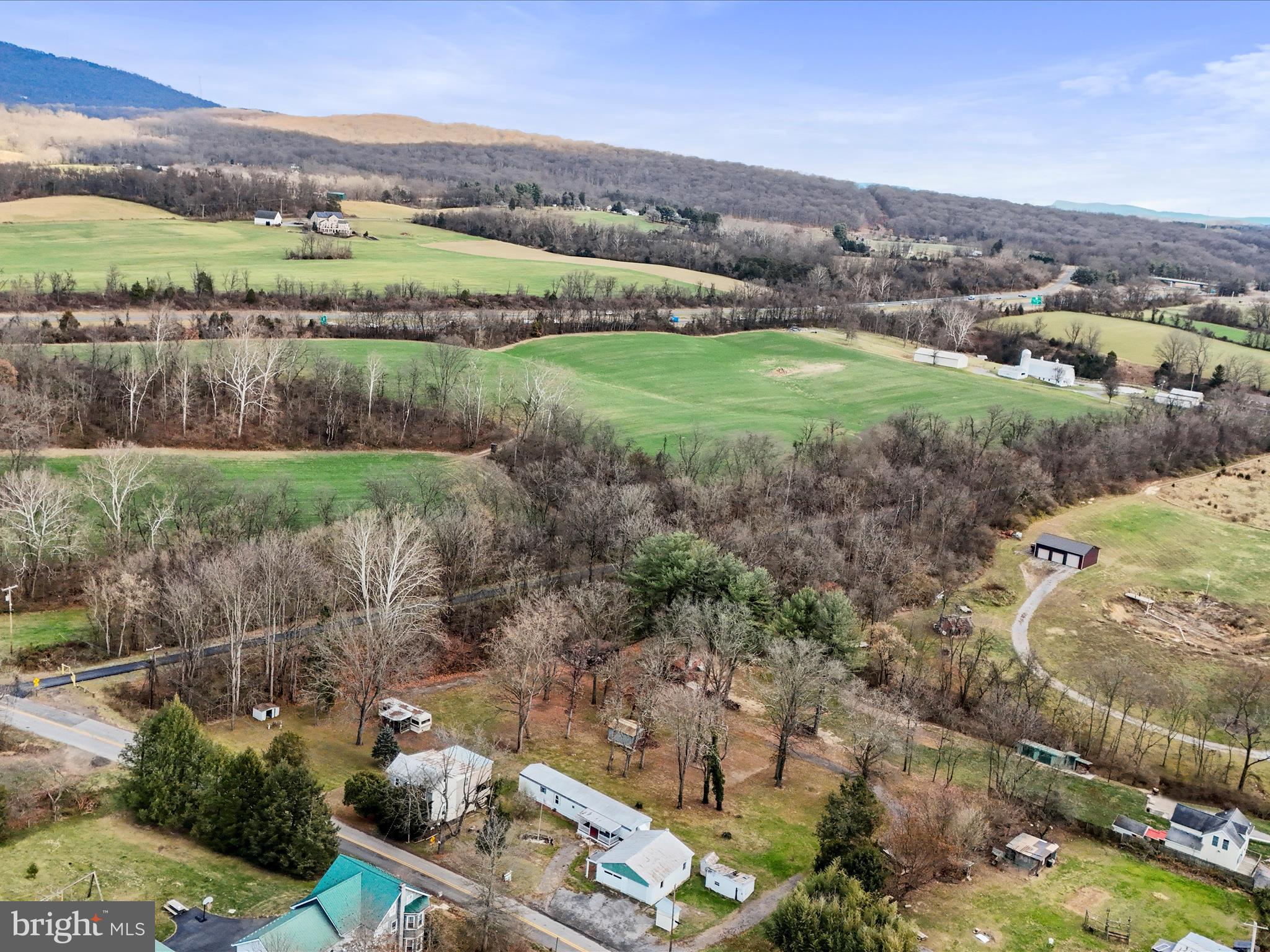 11713 Ernstville Road Big Pool, MD 21711 - Photo 45 of 47 an aerial view of green landscape with trees houses and mountain view