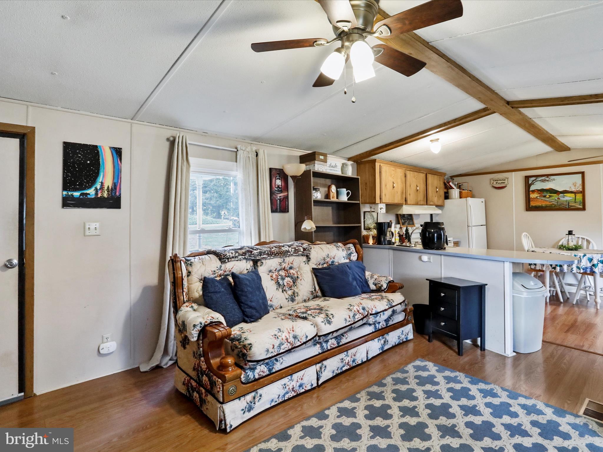 11713 Ernstville Road Big Pool, MD 21711 - Photo 6 of 47 a living room with furniture and a fireplace