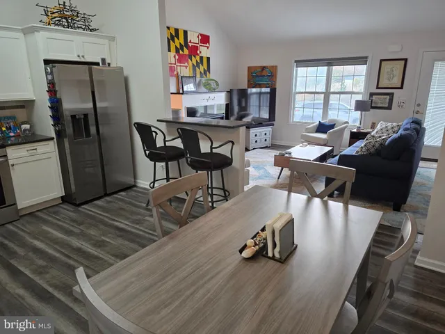 a kitchen with a stove and a refrigerator