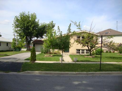 10440 Princess Avenue Chicago Ridge, IL 60415 - Photo 1 of 1 a view of a fountain in front of a house