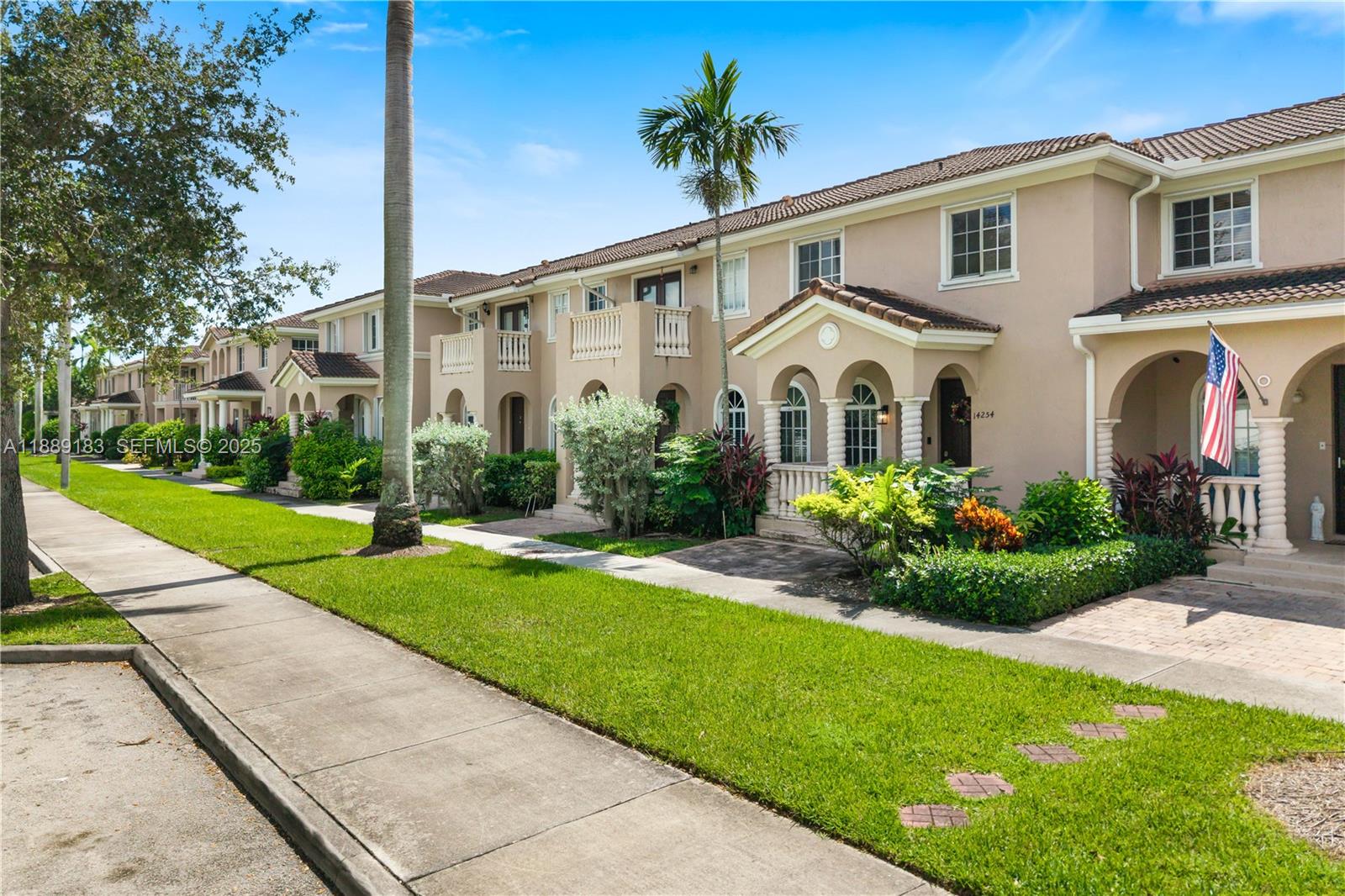 14254 Southwest 272nd Street Homestead, FL 33032 - Photo 1 of 25 a front view of a house with a garden and plants