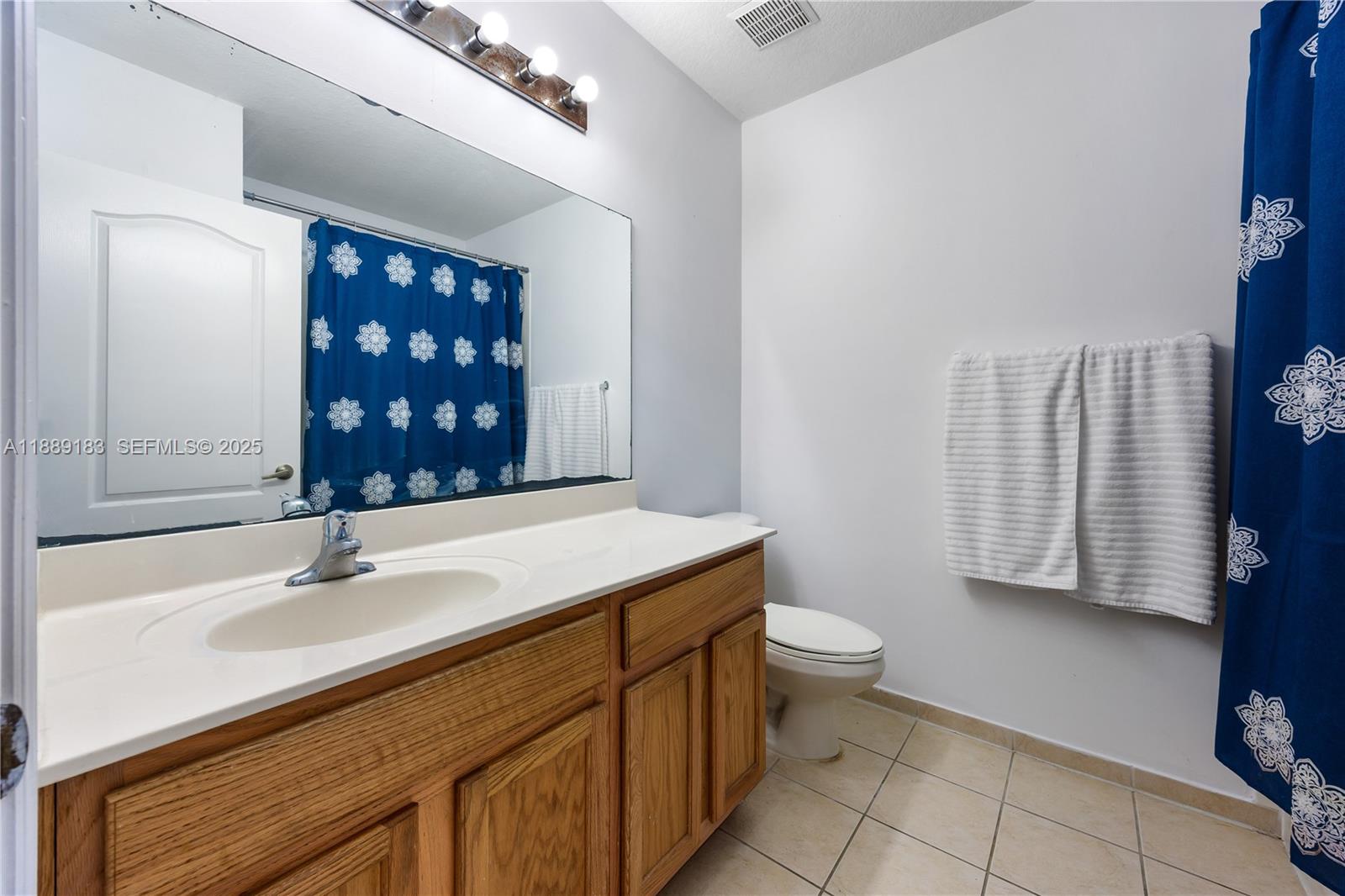 14254 Southwest 272nd Street Homestead, FL 33032 - Photo 11 of 25 a bathroom with a sink toilet and shower