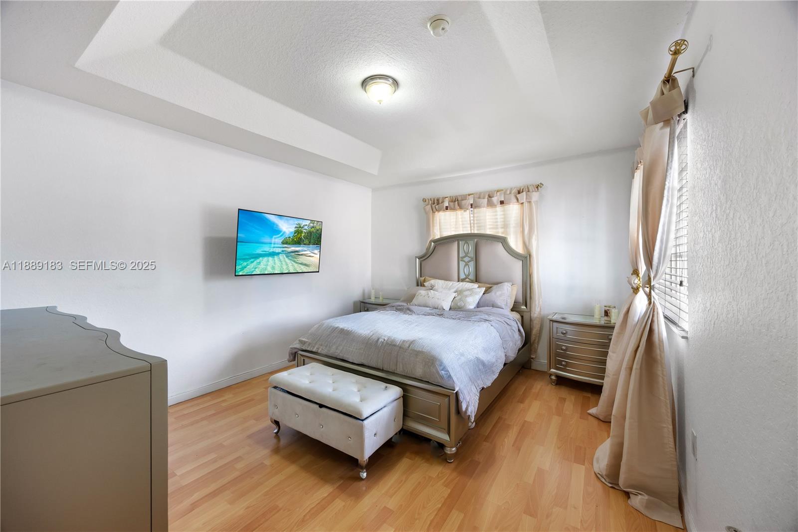 14254 Southwest 272nd Street Homestead, FL 33032 - Photo 15 of 25 a bedroom with a bed and a flat screen tv