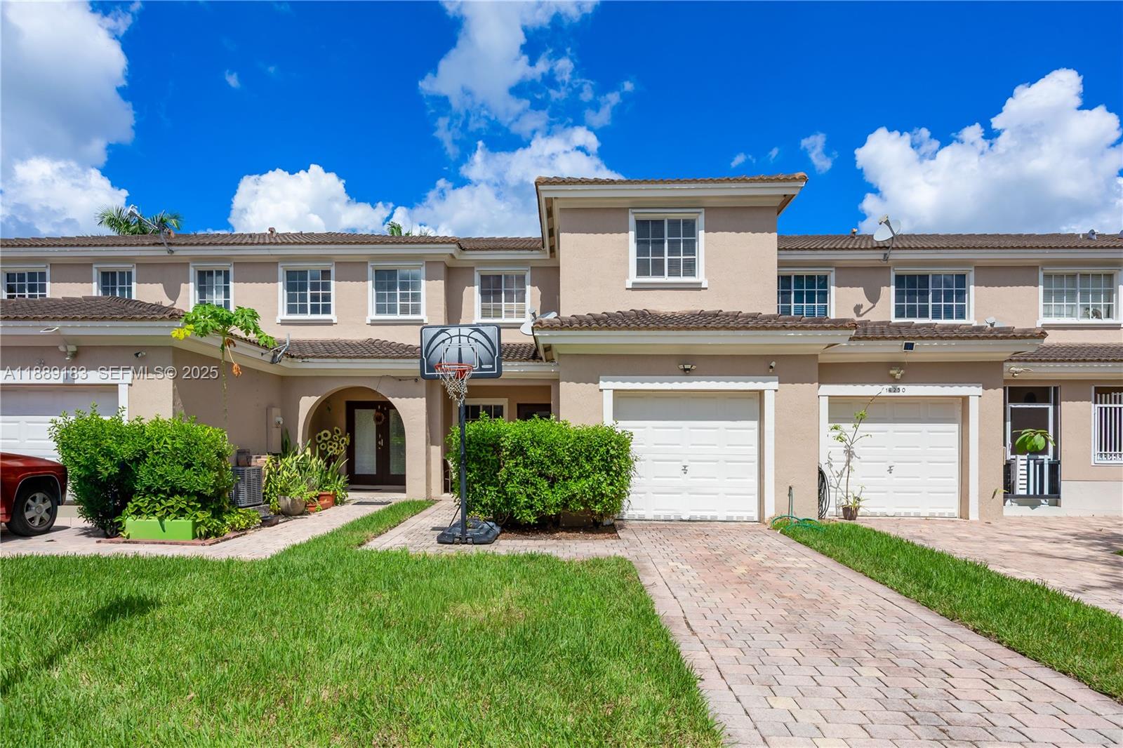14254 Southwest 272nd Street Homestead, FL 33032 - Photo 18 of 25 a front view of a house with a garden