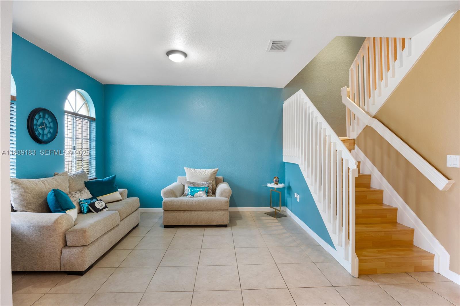 14254 Southwest 272nd Street Homestead, FL 33032 - Photo 2 of 25 a living room with furniture and a rug
