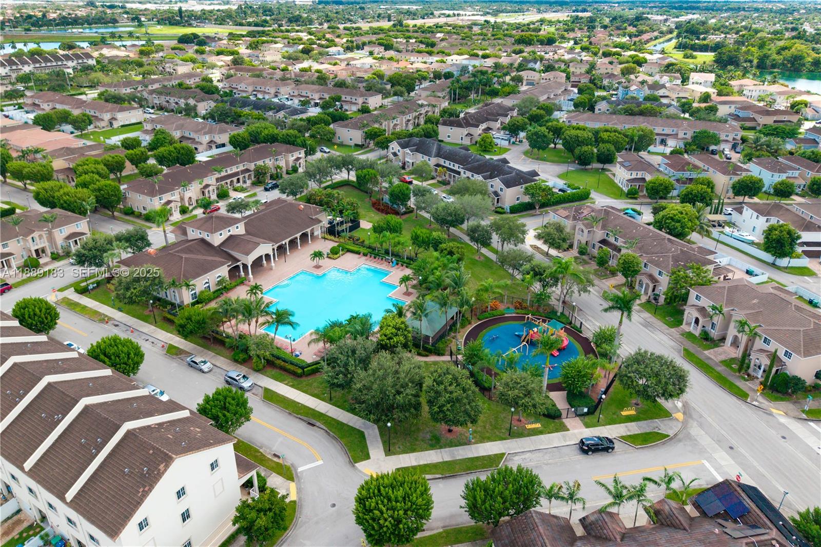 14254 Southwest 272nd Street Homestead, FL 33032 - Photo 23 of 25 an aerial view of a city with lots of residential buildings