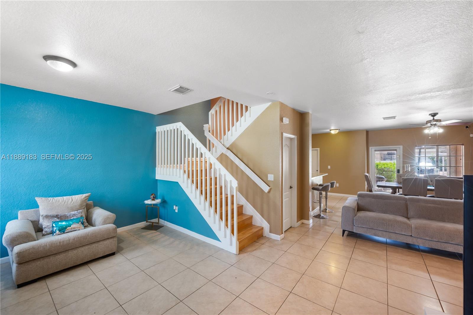 14254 Southwest 272nd Street Homestead, FL 33032 - Photo 3 of 25 a view of livingroom with furniture and stairs