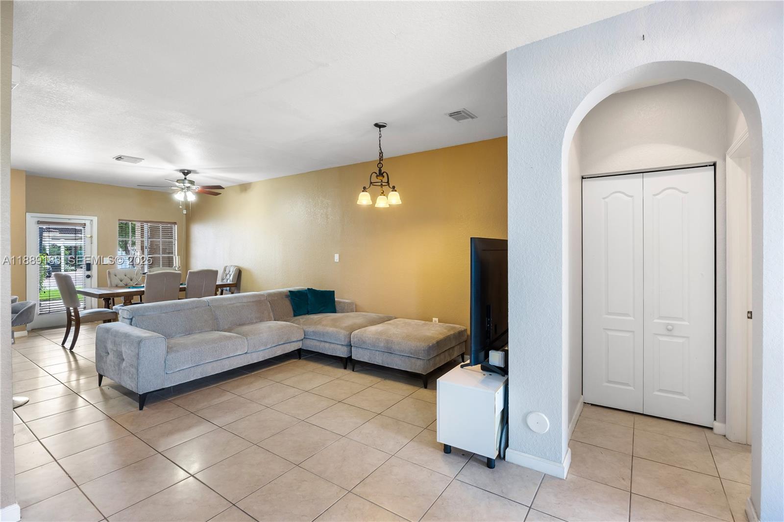 14254 Southwest 272nd Street Homestead, FL 33032 - Photo 4 of 25 a living room with furniture and wooden floor