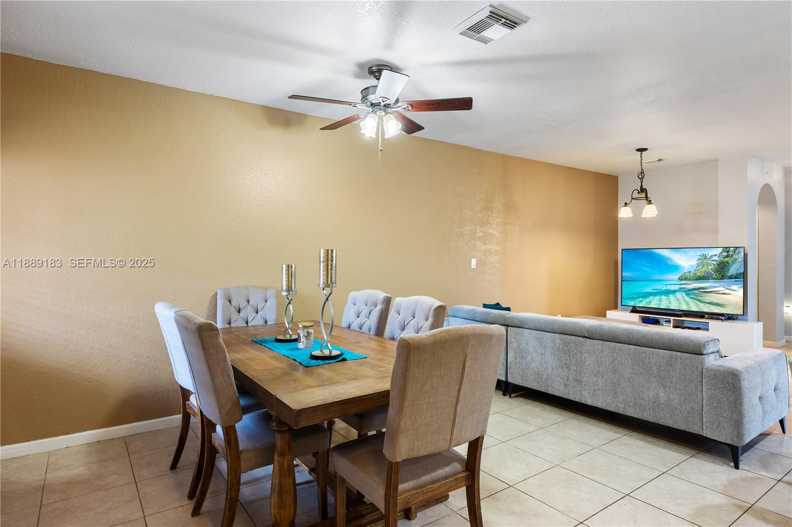 14254 Southwest 272nd Street Homestead, FL 33032 - Photo 6 of 25 a view of a dining room with furniture and a chandelier