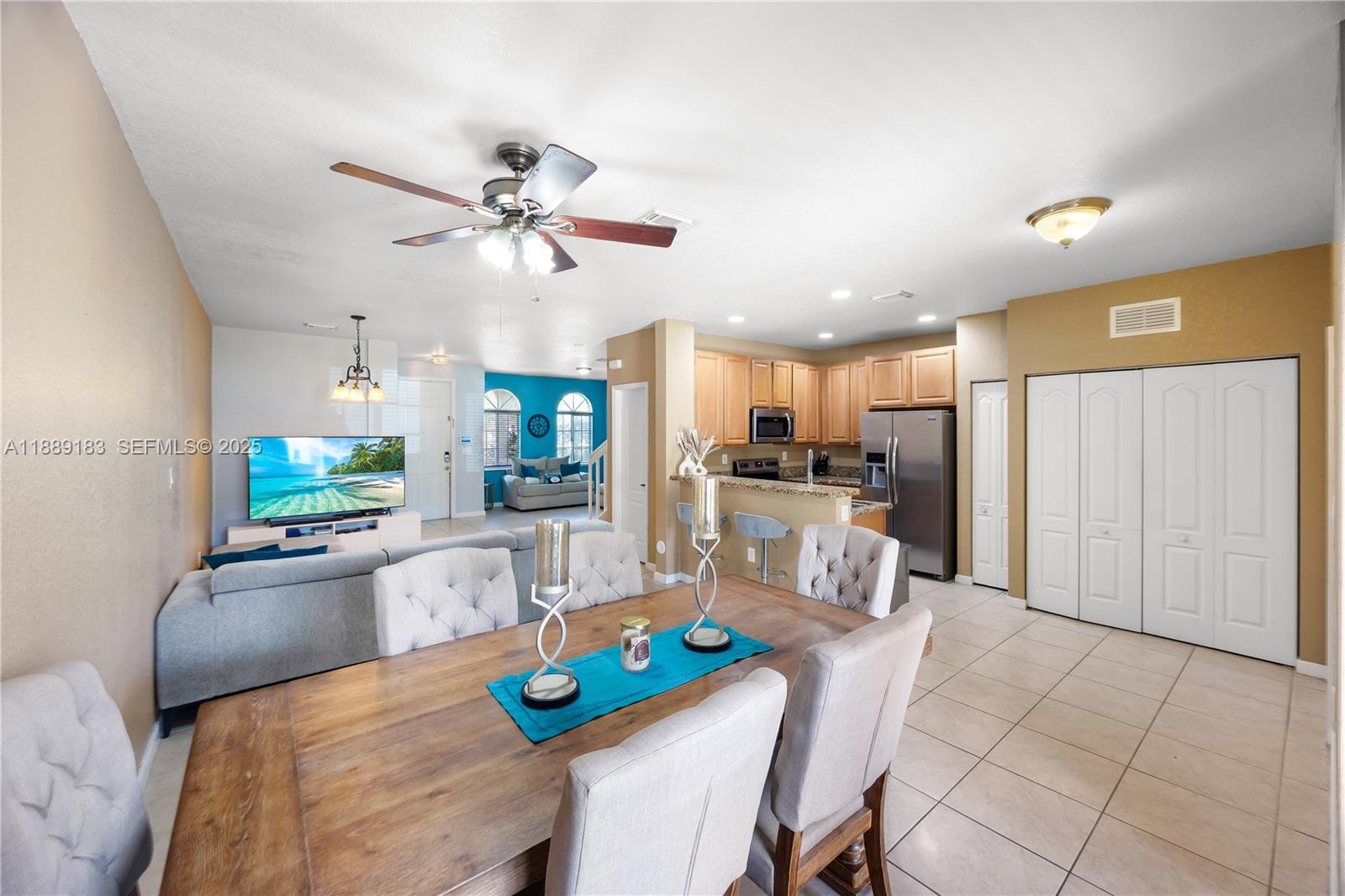 14254 Southwest 272nd Street Homestead, FL 33032 - Photo 7 of 25 a view of a dining room with furniture and a kitchen view