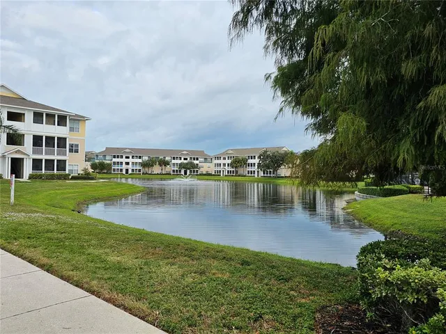 a view of a lake with a building in the background