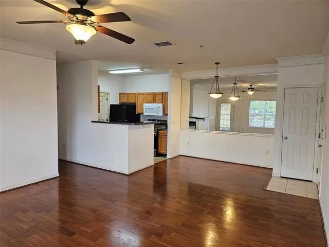 a view of a kitchen with a sink dishwasher and a microwave
