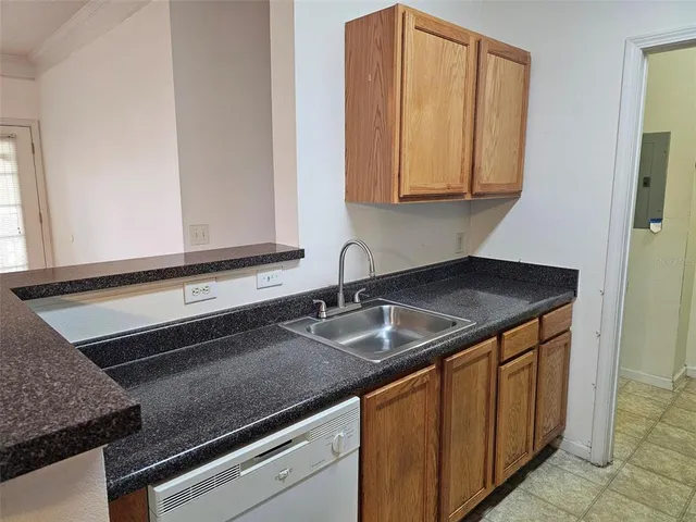 a kitchen with granite countertop a sink and a granite counter tops
