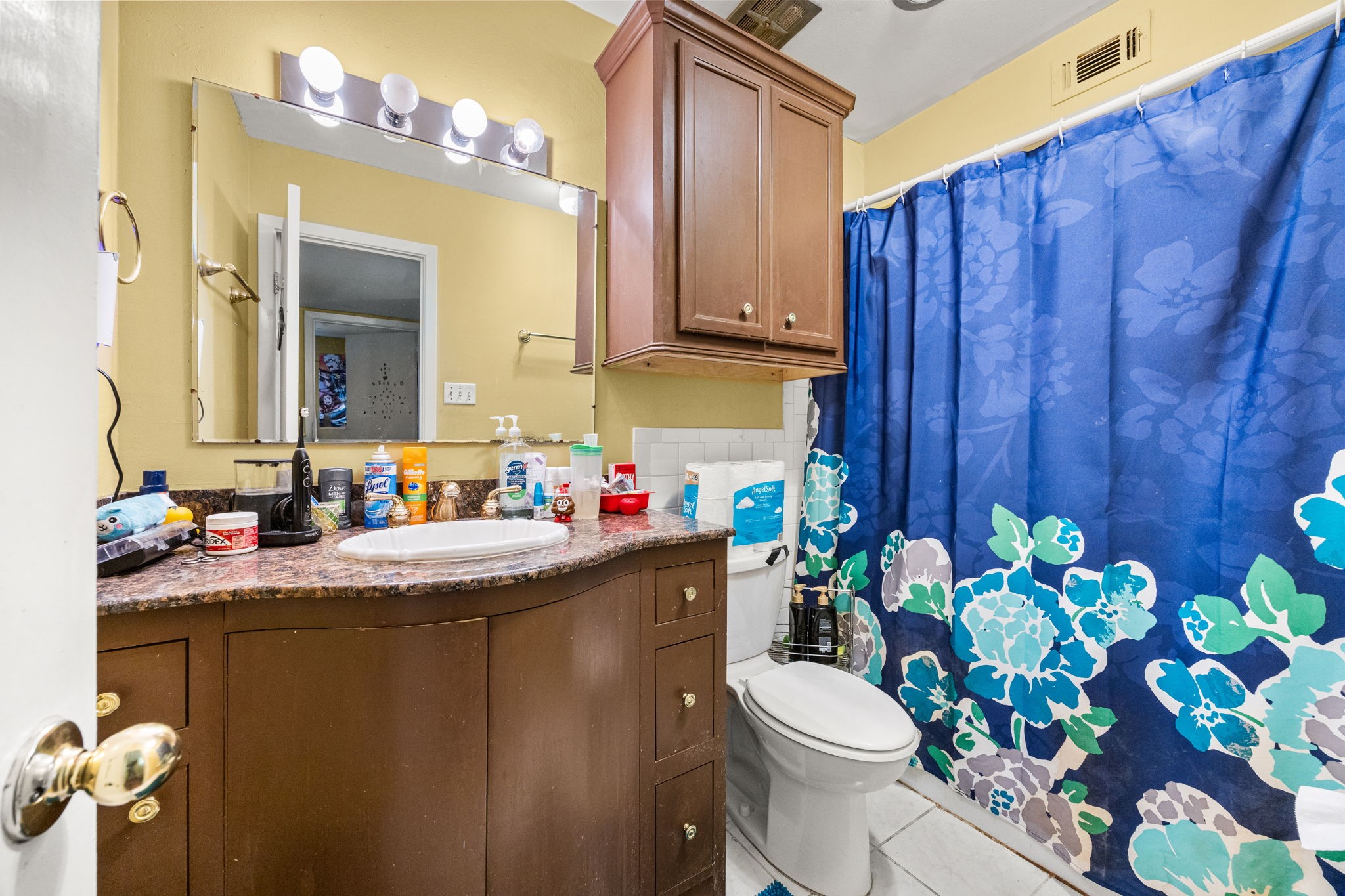 9023 Gaylord Drive, Unit 101 Houston, TX 77024 - Photo 13 of 23 a bathroom with a sink a toilet and mirror