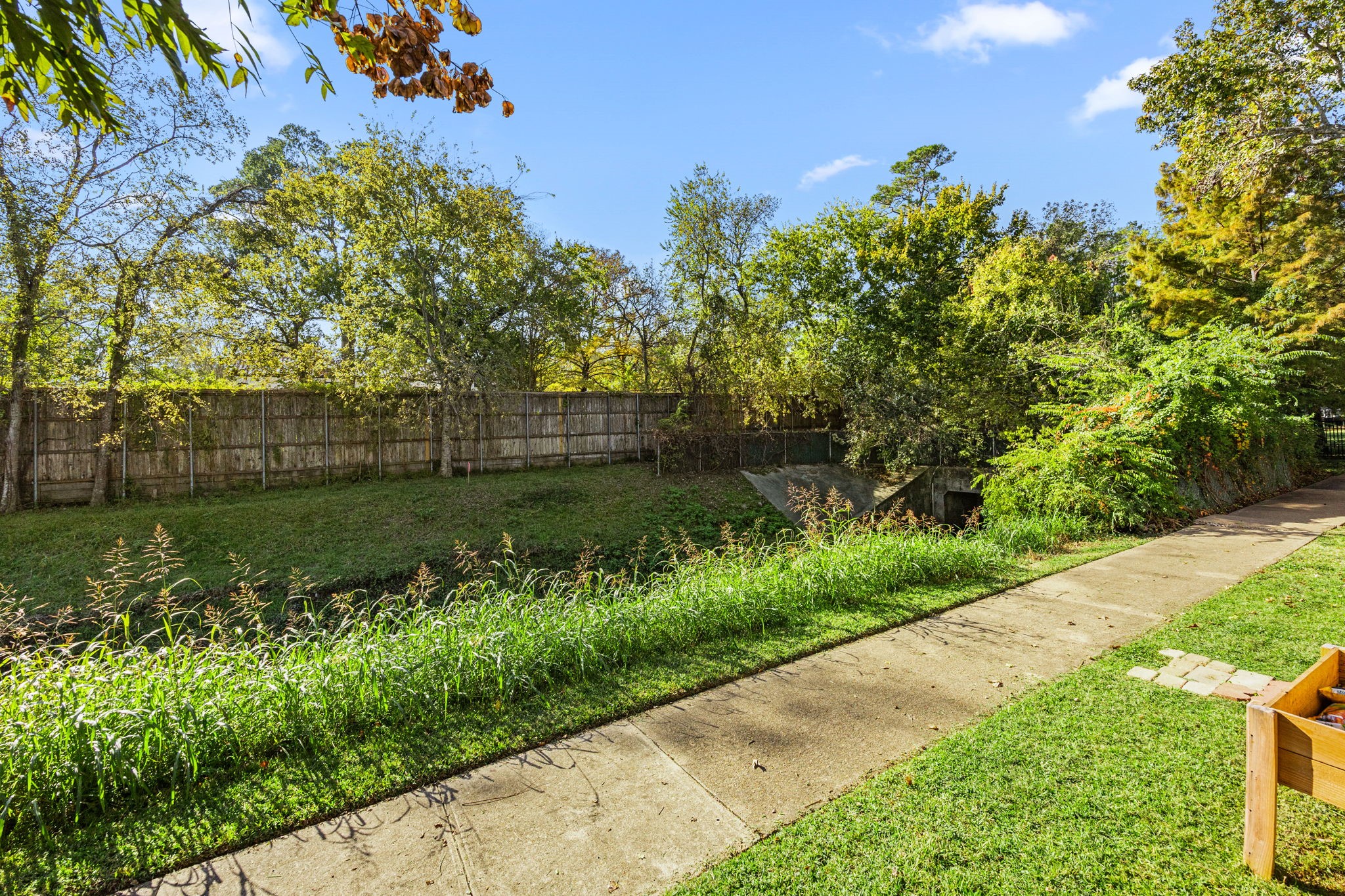 9023 Gaylord Drive, Unit 101 Houston, TX 77024 - Photo 17 of 23 a view of a garden with a pathway