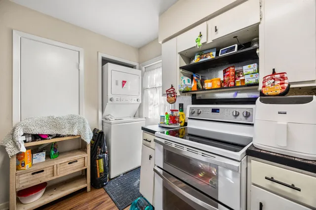 a kitchen with stainless steel appliances a stove and a microwave