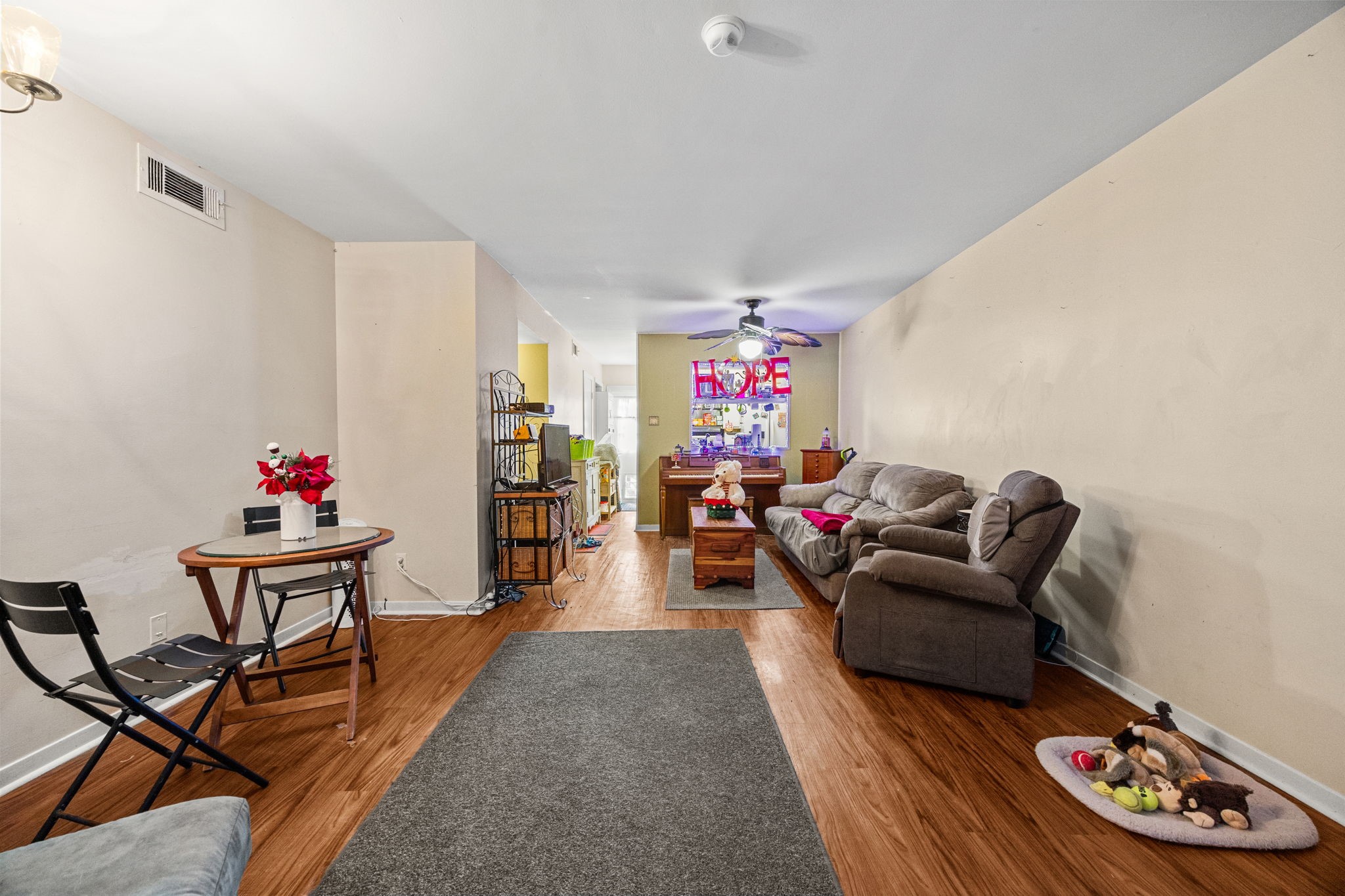 9023 Gaylord Drive, Unit 101 Houston, TX 77024 - Photo 8 of 23 a living room with furniture and wooden floor