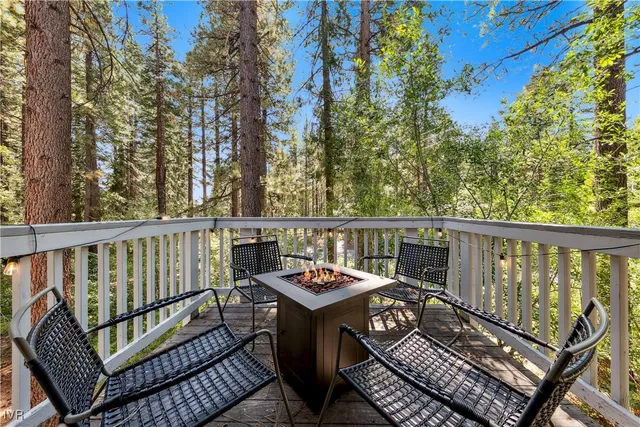 a view of a balcony with wooden floor