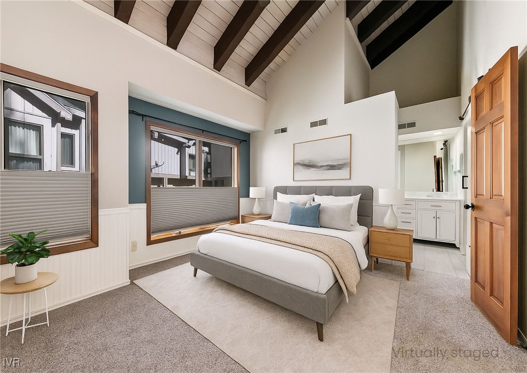 908 Harold Drive, Unit 23 Incline Village, NV 89451 - Photo 13 of 44 a spacious bedroom with a bed a couch and potted plant