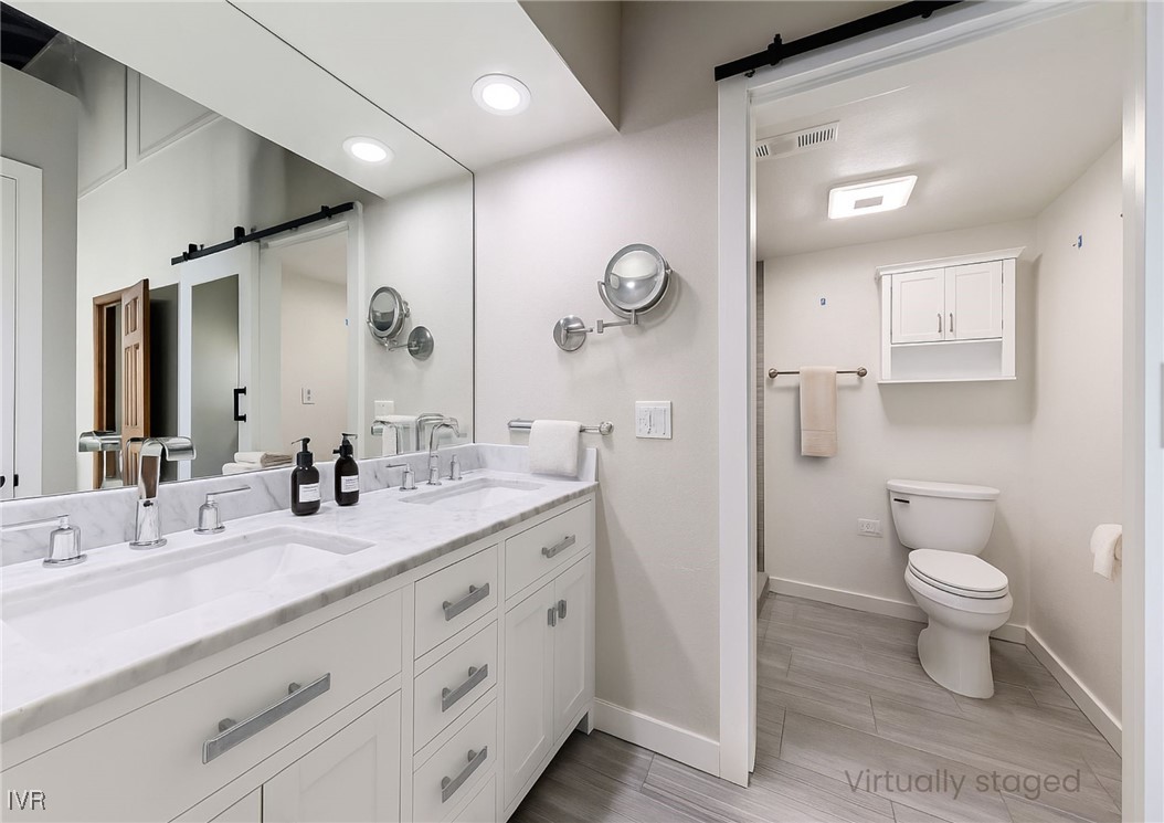 908 Harold Drive, Unit 23 Incline Village, NV 89451 - Photo 14 of 44 a bathroom with a double vanity sink mirror and toilet