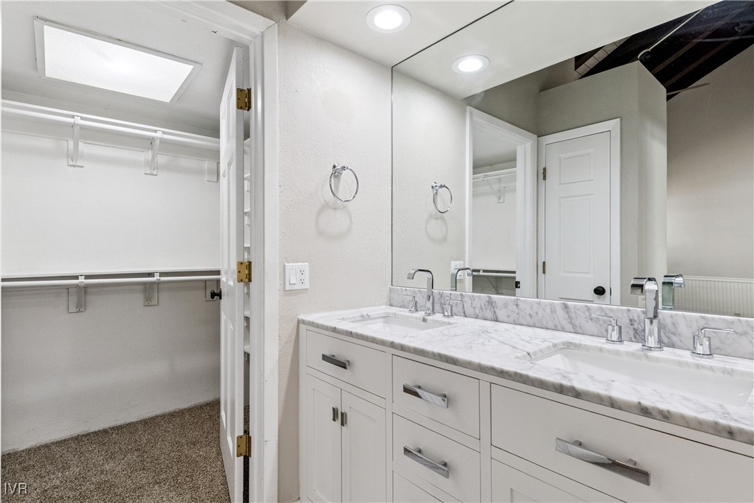 908 Harold Drive, Unit 23 Incline Village, NV 89451 - Photo 15 of 44 a bathroom with a granite countertop sink mirror and double