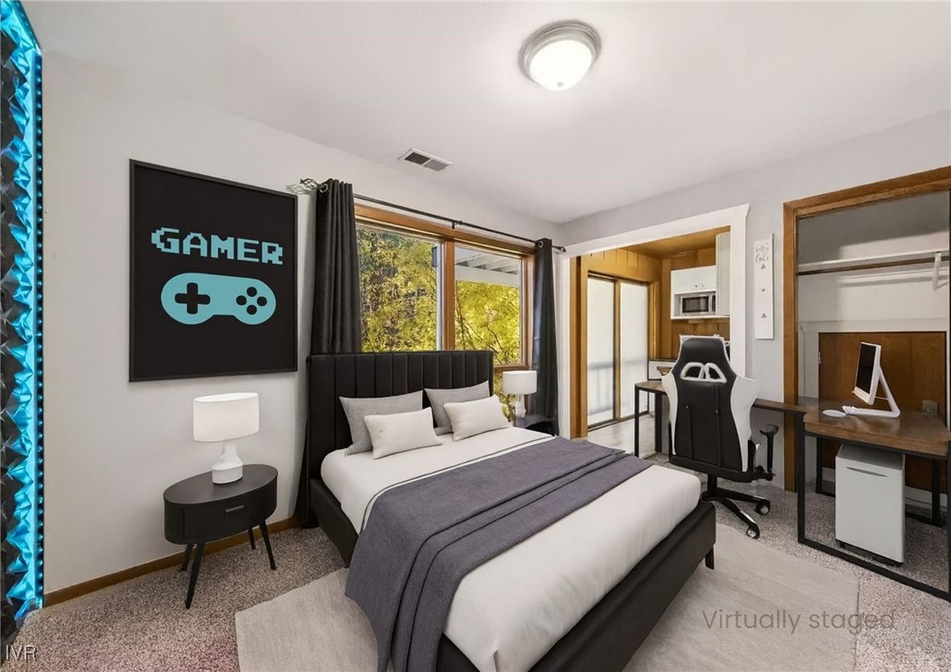 908 Harold Drive, Unit 23 Incline Village, NV 89451 - Photo 27 of 44 a bedroom with a bed and a flat screen tv