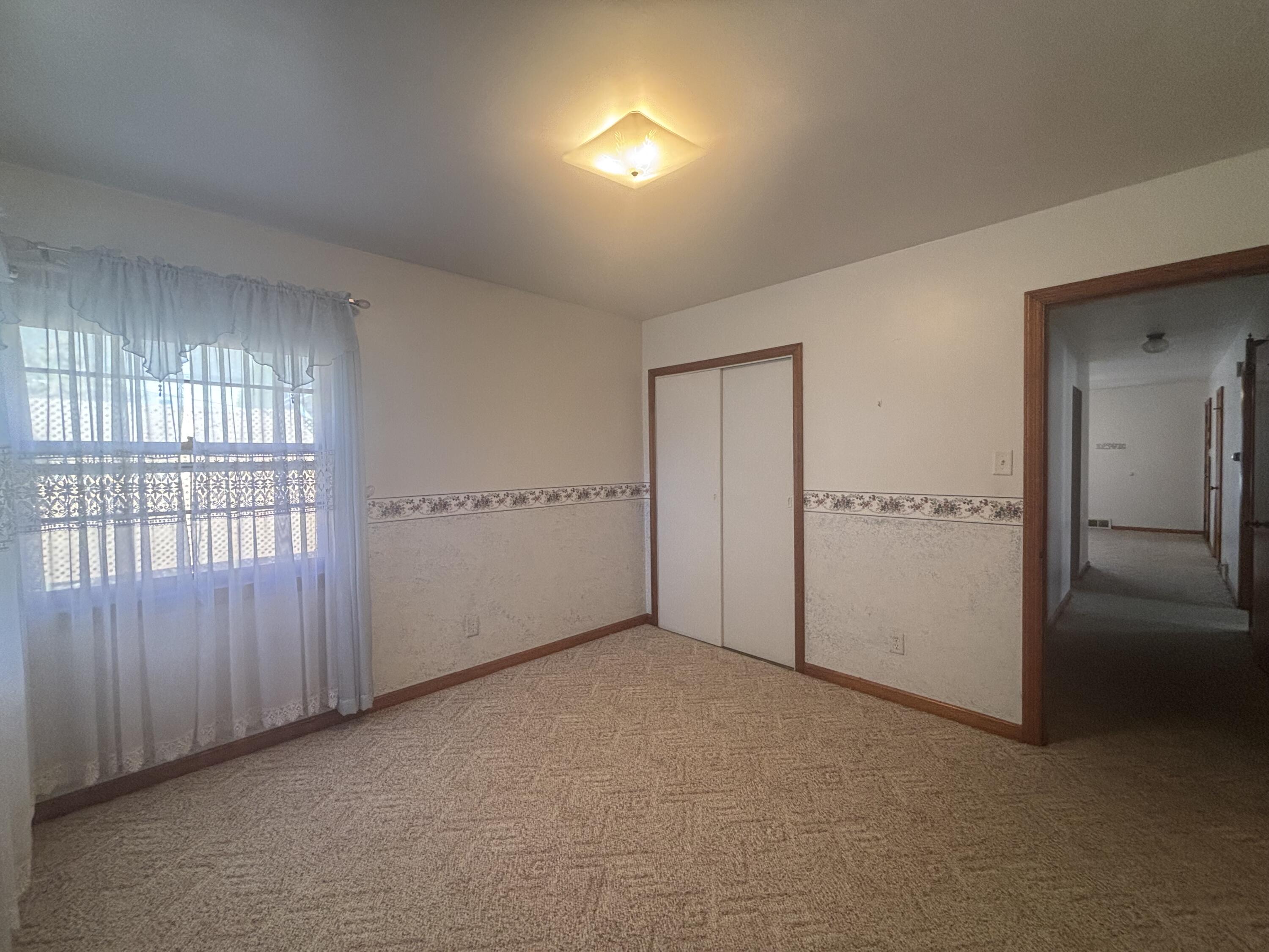 402 South Home Avenue Rensselaer, IN 47978 - Photo 15 of 27 an empty room with windows and closet