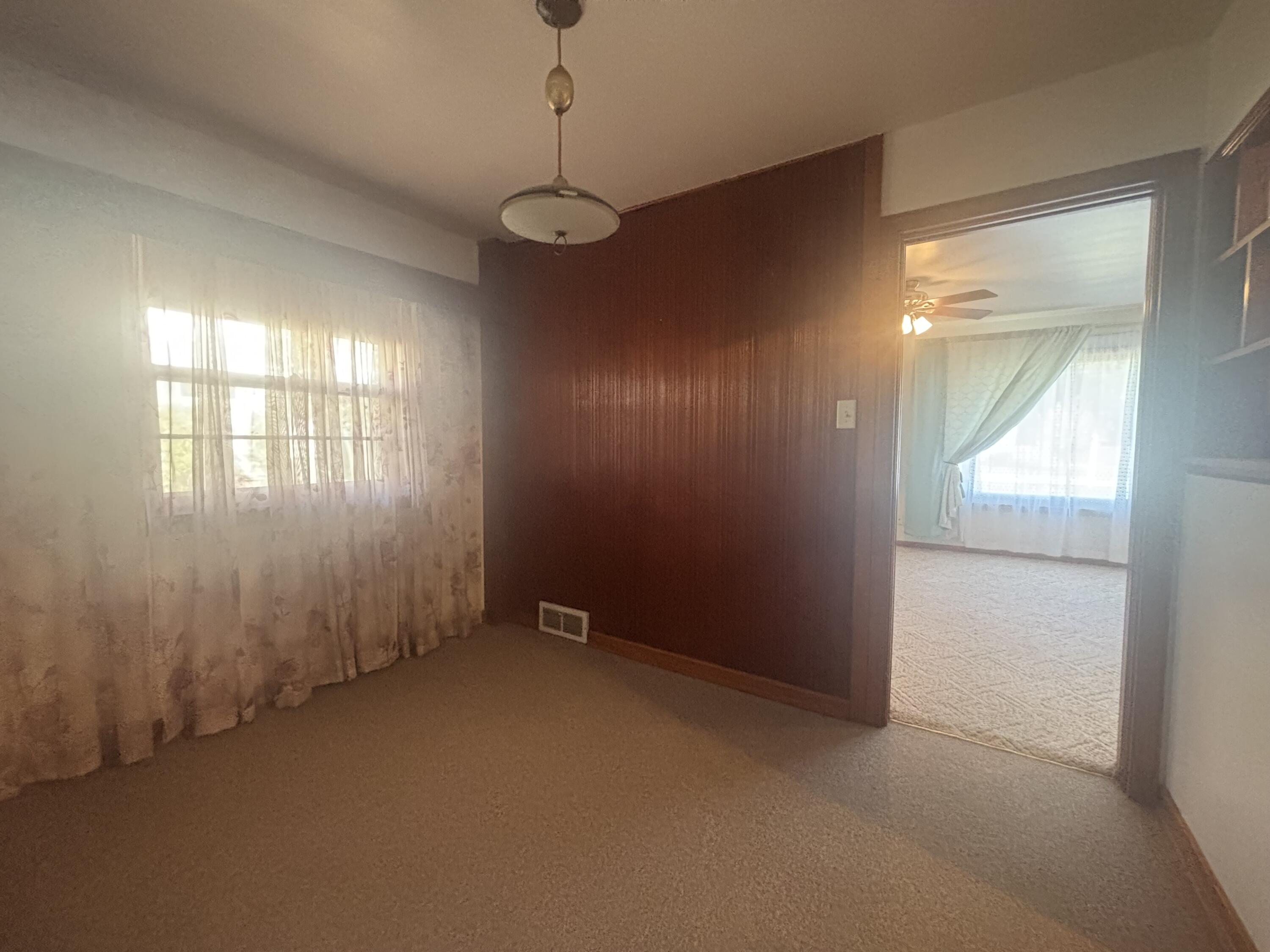 402 South Home Avenue Rensselaer, IN 47978 - Photo 9 of 27 wooden floor in an empty room with a window