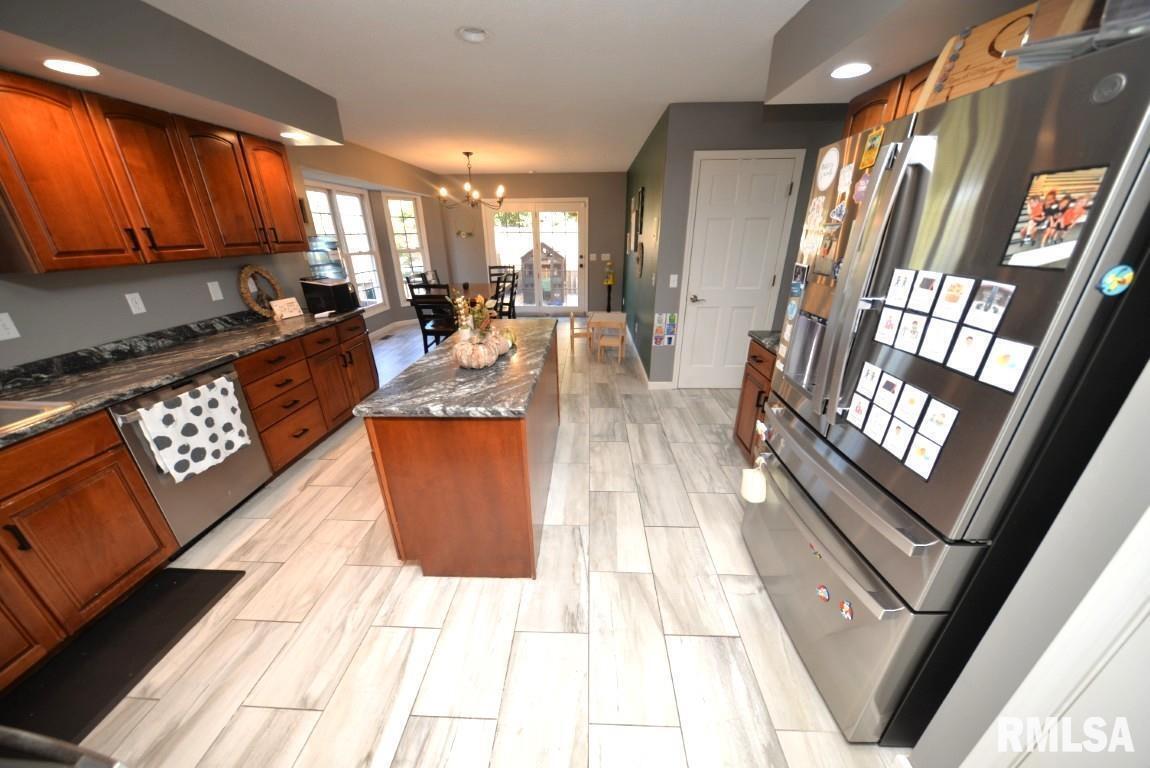 501 Cardinal Drive Mount Vernon, IL 62864 - Photo 27 of 57 a large kitchen with stainless steel appliances granite countertop a stove a sink dishwasher and cabinets