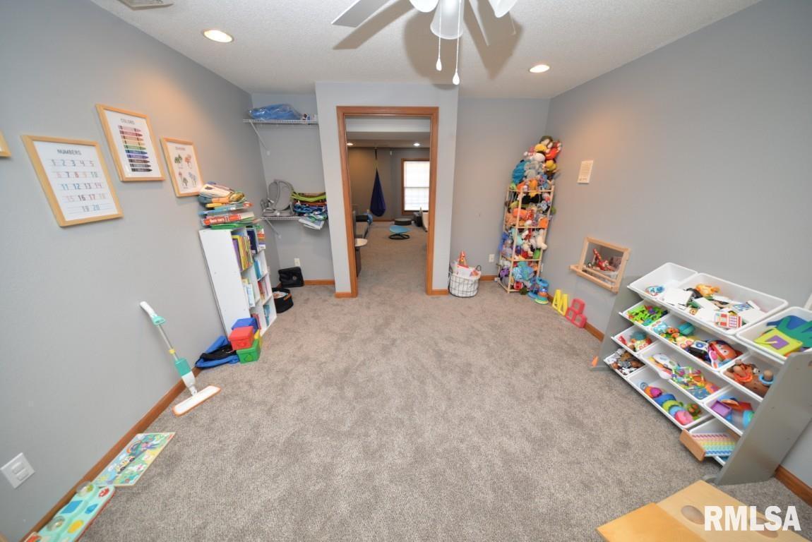 501 Cardinal Drive Mount Vernon, IL 62864 - Photo 37 of 57 a bed room with a bed and a chandelier